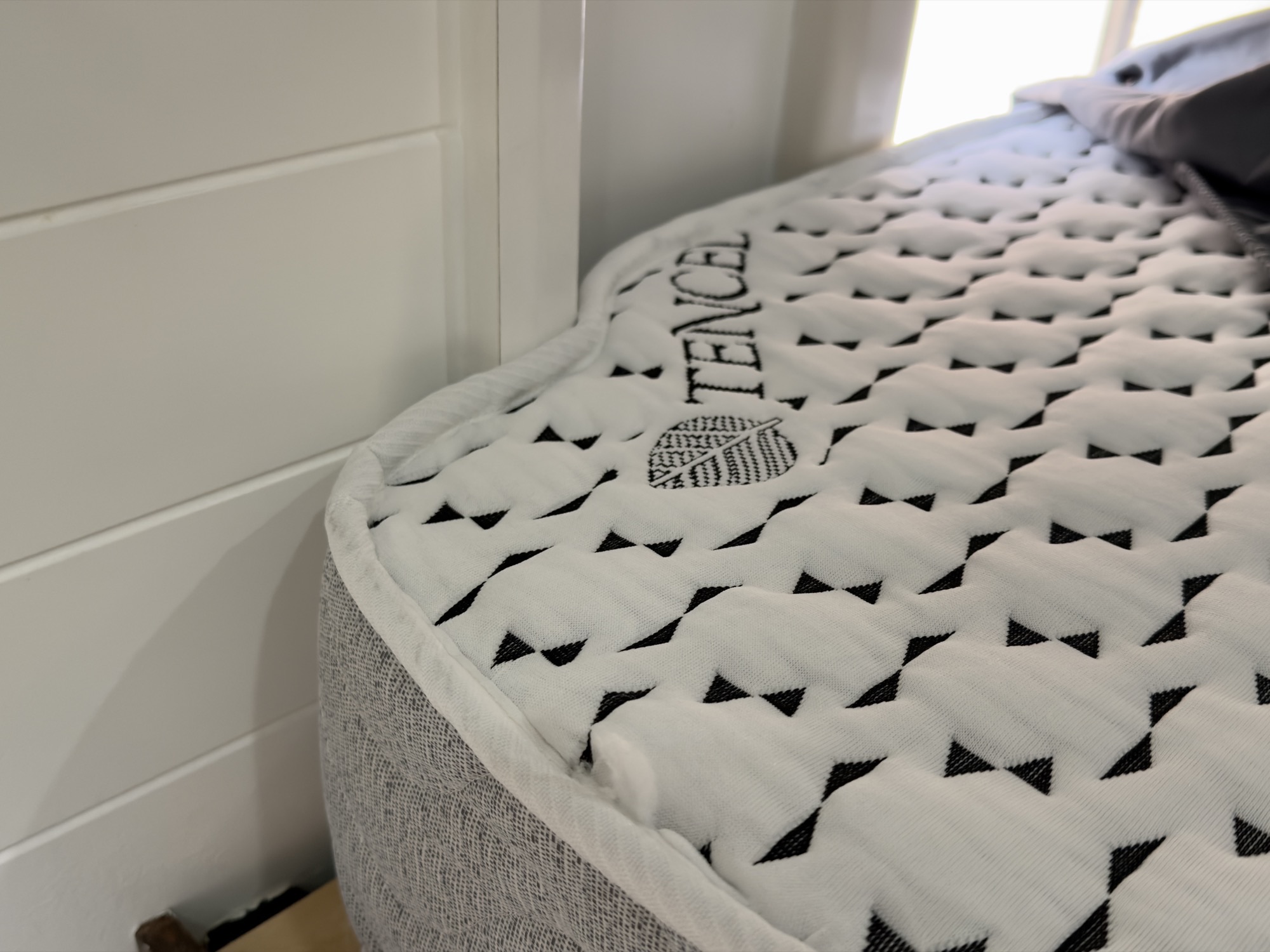 Close up of the Tencel branded quilted top on the custom mattress